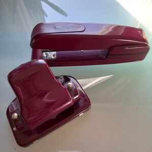 CLassy burgundy color coordinated stapler, and 2 hole punch.